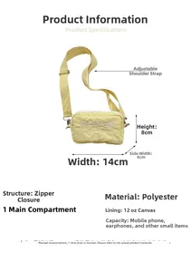 Detail view of yellow embroidered bow bag with dimensions 14x8x6cm and adjustable strap