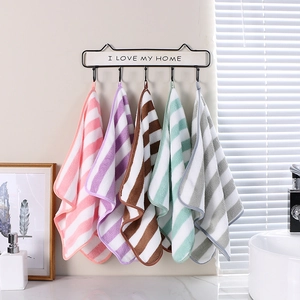 Absorbent coral fleece striped hand towels with hanging loops in five pastel colors