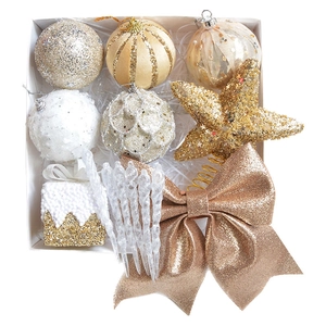 Christmas decoration set with gold and silver balls, stars, and bow in a box