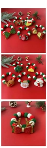 Detail of Christmas pet collar with festive plush balls, reindeer bows and bells