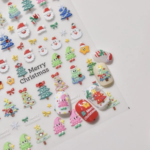 Vue macro détaillée de stickers à ongles Noël 3D avec strass et motifs de nœuds papillons