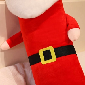 Close-up of Santa plush pillow showing red soft fabric and black belt detail