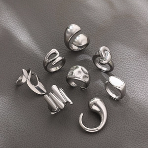 Eight-piece set of silver minimalist rings with polished knot and geometric designs