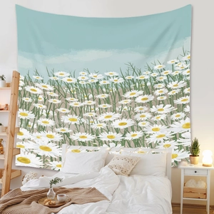 Detail of Bohemian tapestry with white daisies and light blue sky in a cozy bedroom setting