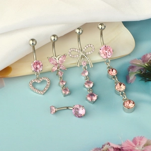 5-piece silver belly ring set with pink zircon charms on sea shell background