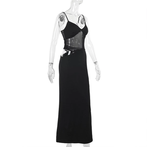 Detail of slim fit black maxi dress featuring mesh splicing and waist cut-out design