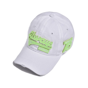 Detailed view of distressed baseball cap brim with neon embroidery and vintage patches