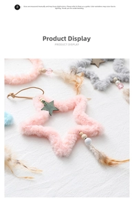 Close-up of plush star and round ornaments with wood accents, beads, and soft feathers
