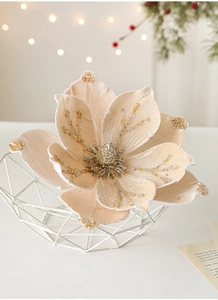 Detailed view of champagne velvet magnolia flower with sparkling gold powder and beads