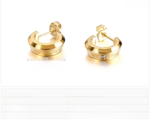 Detail of C-shaped gold stainless steel earrings with zircon and MY LOVE engraving
