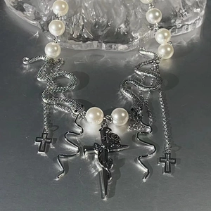 Gothic style necklace with white pearls, silver snake charms and rose dagger pendant