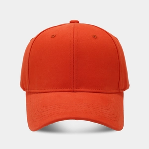 Detail of orange cotton baseball cap showing reinforced stitching and breathable eyelets