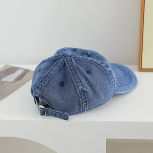 Toddler blue denim baseball cap featuring an adjustable metal buckle in a back-view layout