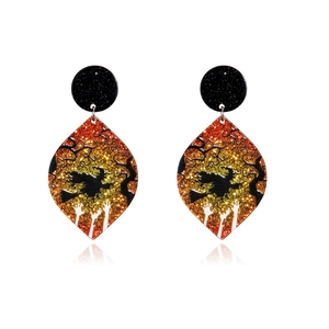 Halloween dangle earrings featuring witch on broomstick silhouette with glitter background