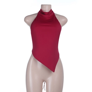 Detail of red halter neck top with irregular hemline on a display mannequin