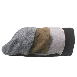 Flat lay of four breathable linen blend beret caps in grey, brown and black colors
