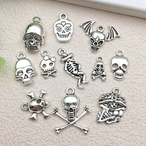 Vintage silver skull alloy charms set in various styles for DIY jewelry making and crafts