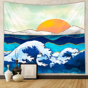 Detailed view of Great Wave tapestry with golden sun hung on a minimalist grey wall