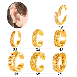 Seven minimalist gold ear cuffs with cubic zirconia inlay and model wearing effect