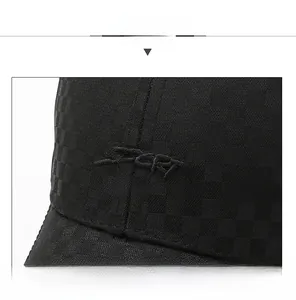 Detail of plaid fabric texture and SPORT embroidery on men's vintage baseball cap