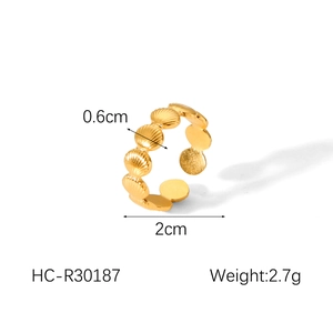 Detail view of gold seashell pattern ring showing 2cm diameter and 0.6cm width dimensions