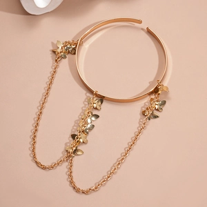 Golden butterfly tassel arm cuff with hanging chains and delicate metal wing charms