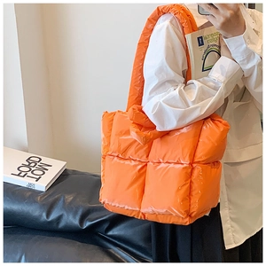 Quilted down cotton tote bag in shiny orange with a padded puffer design and large capacity