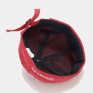 Red cotton Miki hat with Brooklyn embroidery and adjustable strap shown from inside