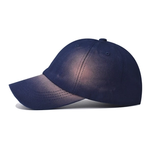 Distressed dark blue denim baseball cap with vintage faded finish and stitched brim