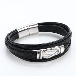 Multilayer black woven leather bracelet with silver magnetic clasp and knot on white background
