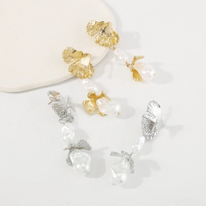 Baroque pearl earrings with metallic leaf texture in gold and silver elegant tones