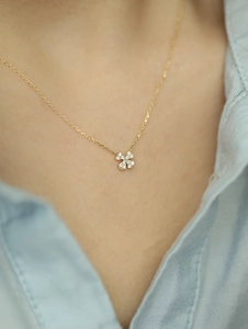Detail of 925 silver 14k gold clover pendant necklace with sparkling micro-pave stones