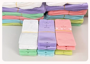 Bulk holographic zip lock bags in pastel colors with clear windows and hanging holes