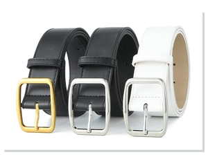Three minimalist leather belts in black and white with gold and silver square buckles