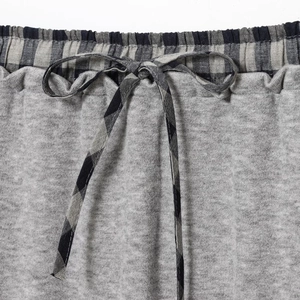 Women's college style gray knit set featuring a black and white checkered drawstring waist