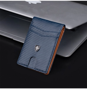 Close-up of slim RFID carbon fiber men's wallet with blue texture and shield logo