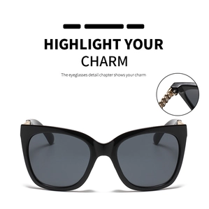 Detail of high-quality metal hinge construction on retro cat eye sunglasses with black frames