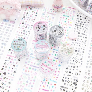 Detail of artistic washi tape set featuring graffiti letters and heart patterns