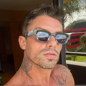 Retro rectangular black sunglasses with thick frames and dark lenses for men in hip hop style
