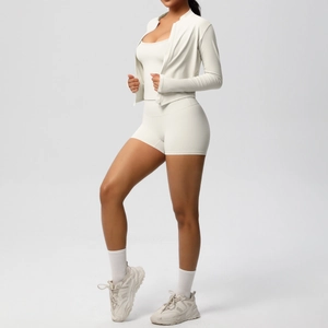 Detail of soft brushed matte fabric on women's yoga set with zip-up jacket and tank top