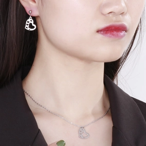 Polished stainless steel heart jewelry set with cutout earrings and pendant necklace