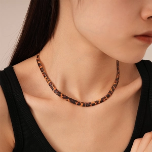 Exaggerated leopard print flat snake chain necklace with retro gold metal finish
