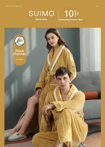 Close-up of thick ginger yellow flannel bathrobes showing warm plush texture and white piping