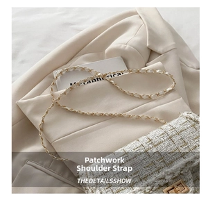 Close-up of beige tweed crossbody bag with gold chain strap and fringed edges details