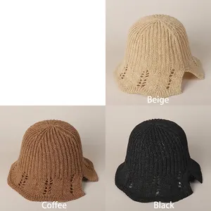 Women's hollow knit sun hat with wavy brim shown in beige, brown, and black colors