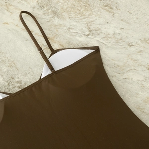 Detail of adjustable straps and built-in padded cups on a brown slim fit bodysuit