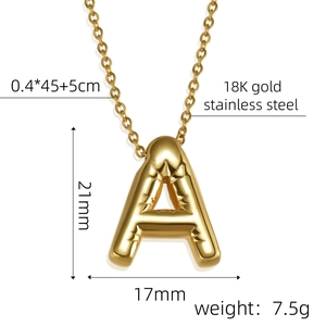 Macro detail of gold 18K stainless steel 'A' initial necklace with 21mm pendant size