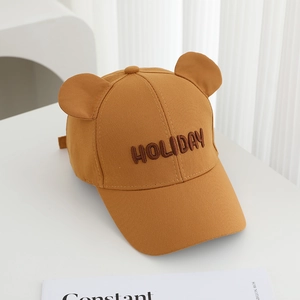 Detailed view of brown cotton baseball cap with 3D bear ears and Holiday embroidery