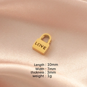 Macro detail of golden stainless steel LOVE lock charm with precise size dimensions