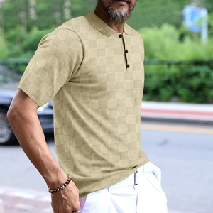 Detail of men's beige polo shirt showing waffle knit texture and three-button collar